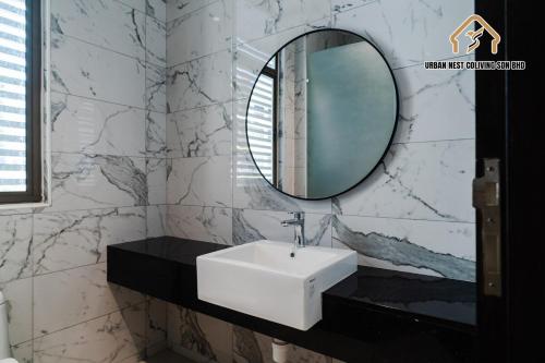 a bathroom with a white sink and a mirror at Georgetown Greenish Kid-Friendly KTV 3BR 15pax B in George Town