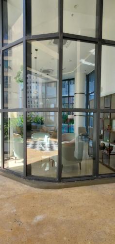 a large glass window of a building with a lobby at Luxury 32nd Floor 2 Bed-2 Bath Apartment with Pool, Harbour & Lotus Tower views in Colombo