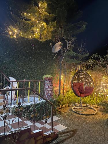a person jumping in the air at night at Oxygen Homestay-A Blissful Retreat in Dehradun