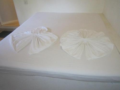 Katil atau katil-katil dalam bilik di Anicia Beach House