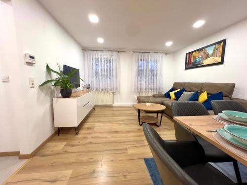 a living room with a couch and a table at MD Apartments Stuttgart Zuffenhausen in Stuttgart
