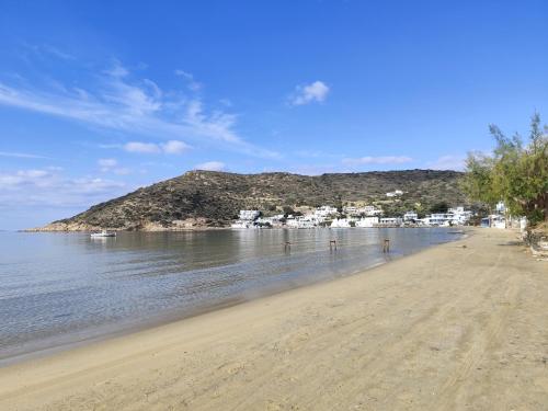 a view of a beach with houses and the water at Agrilia Apartments & Studios in Vathi