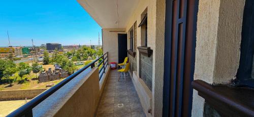 a balcony of a building with a view of a city at Homey Haven in Juja
