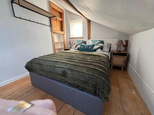 a bedroom with a bed and a window at The old pub in Docking in Docking
