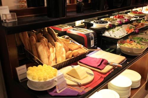 a buffet with many different types of food on display at Ambassador Hanoi Hotel & Spa in Hanoi