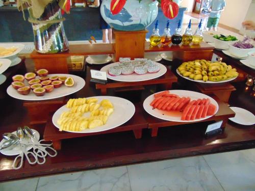 a table with several plates of food on them at Ambassador Hanoi Hotel & Spa in Hanoi