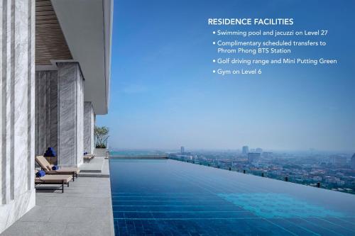 a swimming pool on the roof of a building with a view at 137 Pillars Residences Bangkok in Bangkok