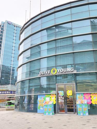 a glass building with a unique young sign on it at Stay Hankan 모던코리아라이프 in Seoul