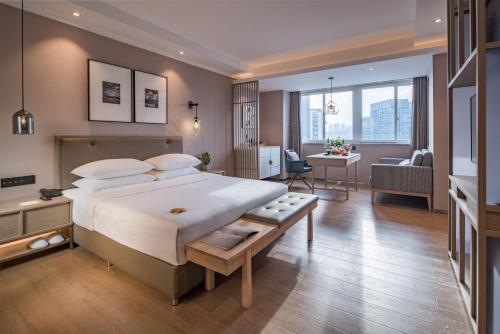 Postel nebo postele na pokoji v ubytování Chongqing Liangjiang New District Yunxi Hotel