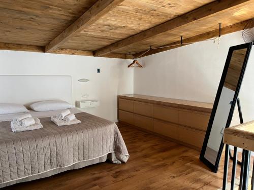 a bedroom with a bed and a tub in it at Davis Home in Brindisi