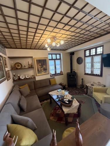 a living room with a couch and a table at Petrini Armonia, Vitsa Zagori in Vitsa