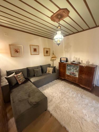 a living room with a couch and a table at Petrini Armonia, Vitsa Zagori in Vitsa