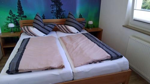 Postel nebo postele na pokoji v ubytování Ferienwohnung Härtel