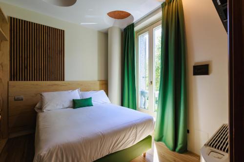 Katil atau katil-katil dalam bilik di Botanique Hotel Vergani