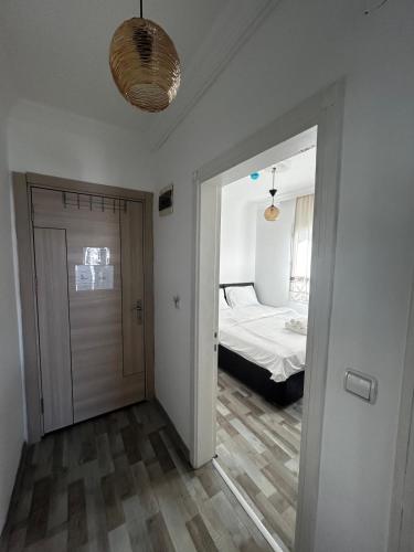 a room with a door leading to a bedroom at Çağlar my hause apart otel in Turgutreis