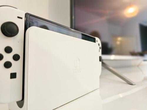 an ipod sitting on top of a counter with at EDMUNDs - Bergblick im Wanderparadies, Nintendo Switch, Parkplatz in Bad Berleburg