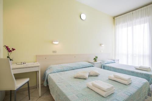 Katil atau katil-katil dalam bilik di Hotel Sant'Angelo