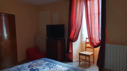 Ένα ή περισσότερα κρεβάτια σε δωμάτιο στο Chambres d'hôtes -- Le Clos de Gémozac