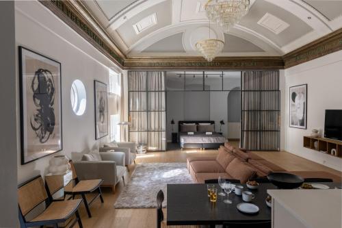 a living room with a couch and a table at Unique 3 Bedroom Apartment in Vibrant Frederiksberg in Copenhagen