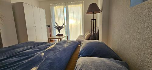 a bedroom with two large pillows on a bed at Magnifique Studio à louer in Evilard