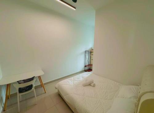 a white room with a bed and a desk at New Akina Kajang2 Homestay 12pax in Semenyih