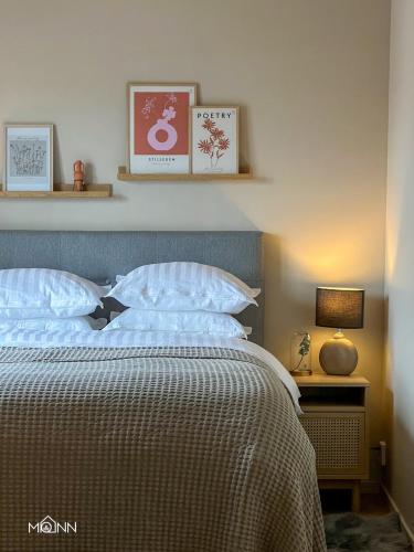 a bedroom with a bed with two pillows at Piteå Relax and Play Billiard Ap1 in Piteå