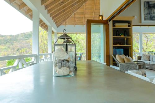 a vase with rocks in it sitting on a table at Stunning 4 bed Villa in Bequia St Vincent in Bequia