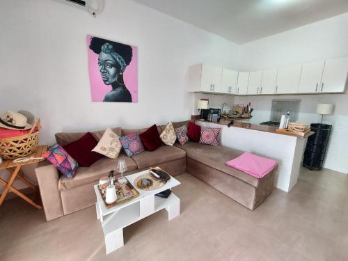 a living room with a couch and a table at Naama wiew- Alle due palme in Sharm El Sheikh
