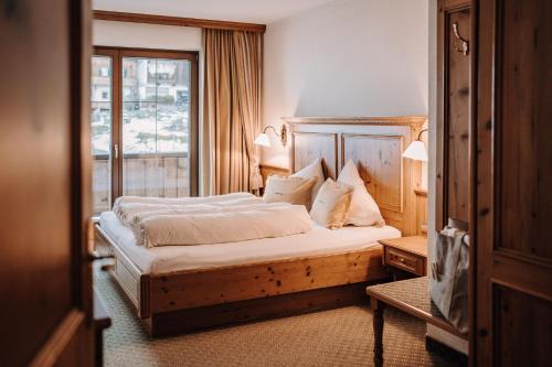 Postel nebo postele na pokoji v ubytování ASTER Boutique Hotel & Chalets