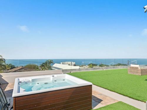 a hot tub on the roof of a house at At 40 Oceanview in Durban