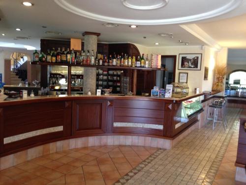 a bar in a restaurant with a counter at La Locanda del Cavaliere in Borgo Montello