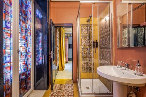 a bathroom with a sink and a shower at Le Stanze al Genio di Darlon in Palermo