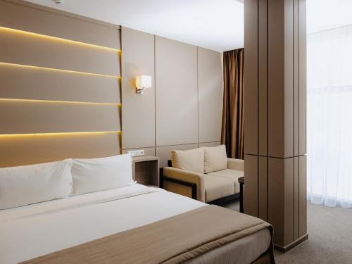 Ένα ή περισσότερα κρεβάτια σε δωμάτιο στο City Stay Bishkek