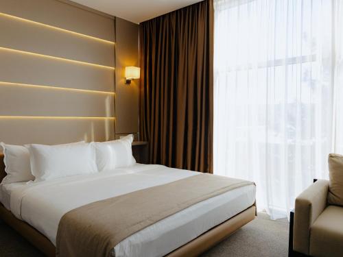 Ένα ή περισσότερα κρεβάτια σε δωμάτιο στο City Stay Bishkek