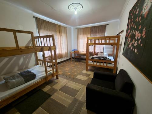 a living room with two bunk beds and a couch at EMMY'S HIDE AWAY in Iringa