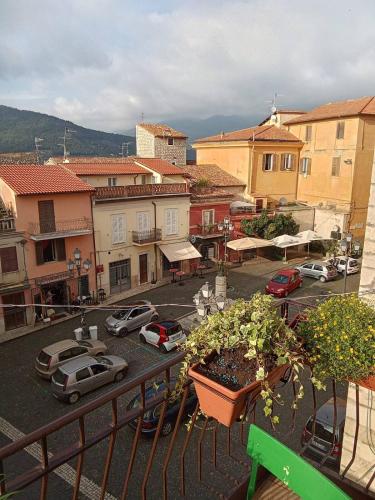 a view of a city with cars parked in a parking lot at B&B Piazza dei Leoni in Sezze