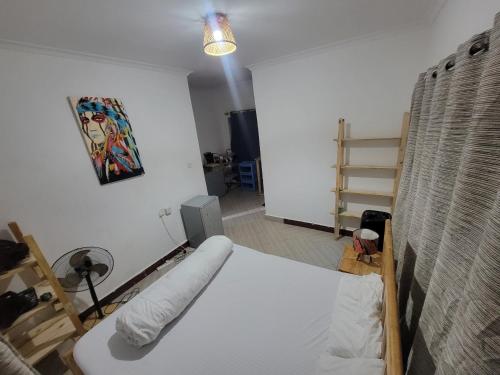 a bedroom with a bed in a room at EMMY'S HIDE AWAY in Iringa