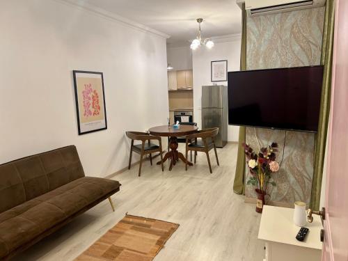 a living room with a couch and a table at Catedrala Blue in Constanţa