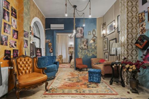 a living room filled with lots of furniture at Creative retreat and Artist Haven Bohemian Villa on Calea Victoriei in Bucharest