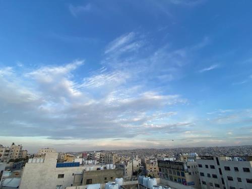 a view of a city under a cloudy sky at Osama Alnaser in Amman