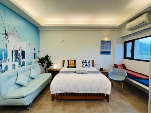 Postel nebo postele na pokoji v ubytování Sea Fun Homestay