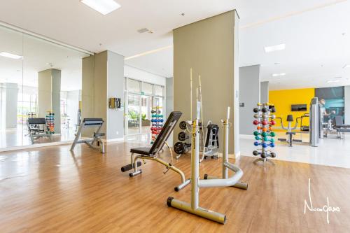 a gym with cardio equipment in a building at Aconchego dentro do Shopping em Brasília in Brasilia