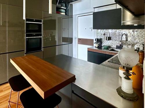 a kitchen with a table and a vase on the counter at YourHome - Casa Anna Amalfi in Amalfi