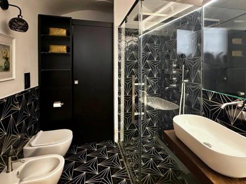 a bathroom with two toilets and a sink and a shower at YourHome - Casa Anna Amalfi in Amalfi