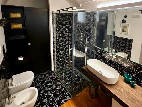 a bathroom with two sinks and a shower at YourHome - Casa Anna Amalfi in Amalfi