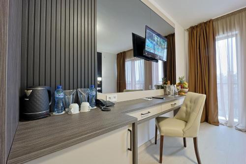 Televiisor ja/või meelelahutuskeskus majutusasutuses Prestige Hotel and Aquapark - All inclusive