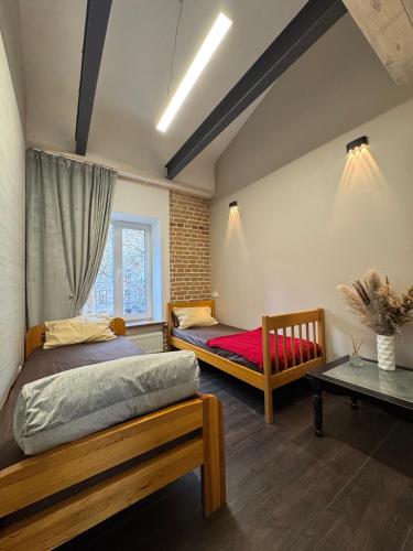Кровать или кровати в номере Apart-Hotel IGORIVSKA