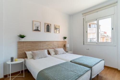 Giường trong phòng chung tại AB North Barcelona Apartments