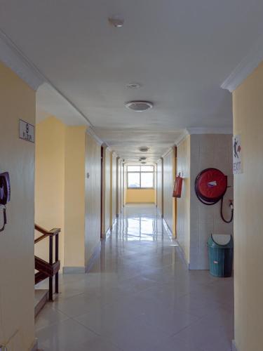 a hallway of a building with a long corridor at Durban Hotel in Dar es Salaam