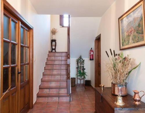 a staircase in a room with a stair case at Casa Rural Vielba in Barruelo de Santullán